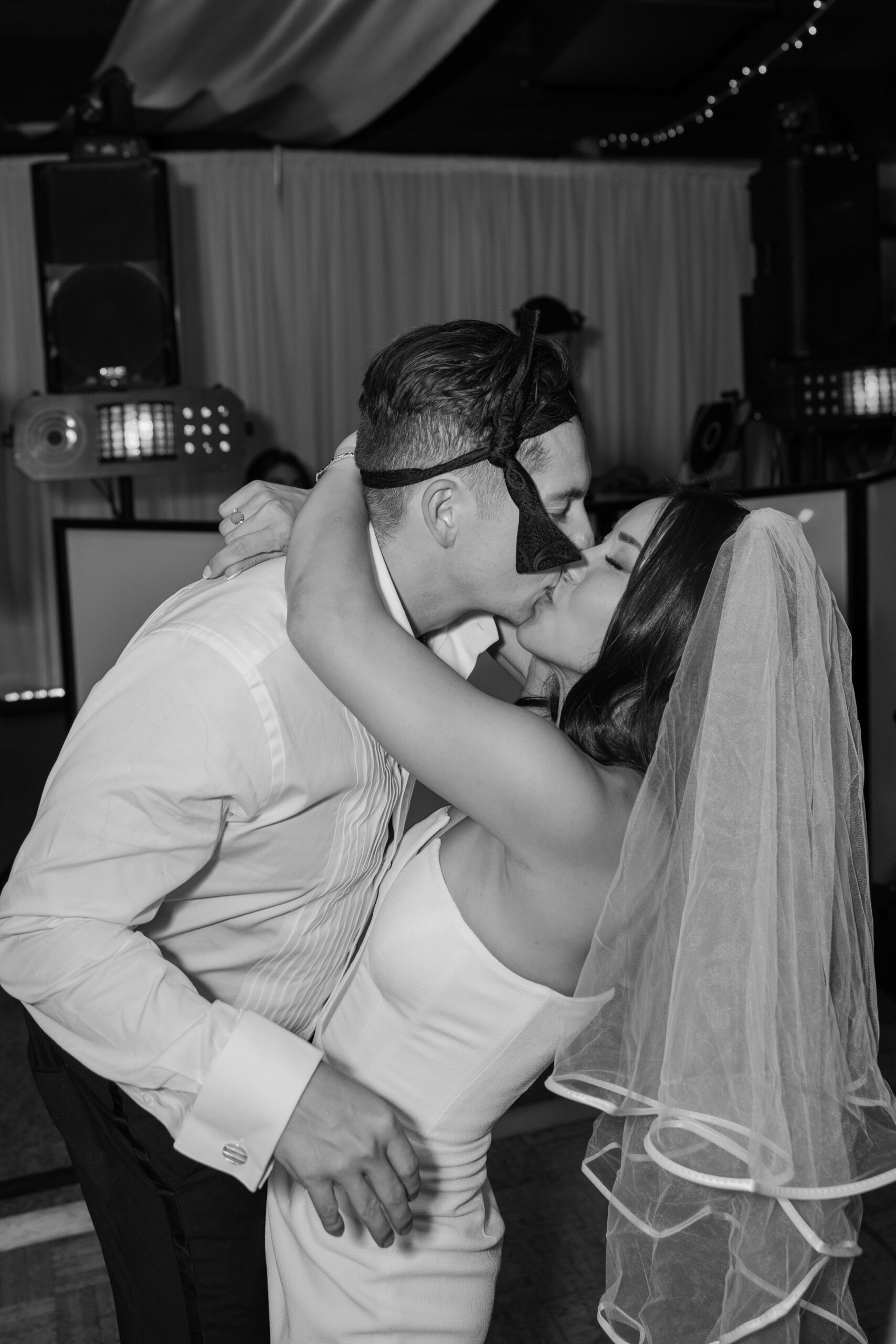 Bride and groom sharing a dramatic kiss on the dance floor during the after-party at McCormick Ranch Golf Club.